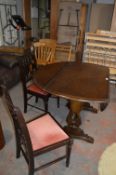 Oval Dark Oak Dining Table and Two Chairs