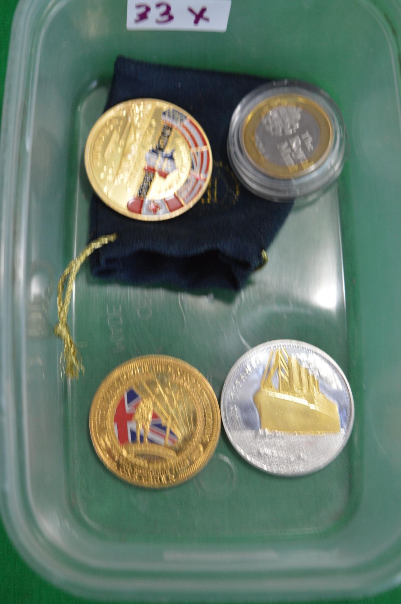 Four Commemorative Coins Including Titanic