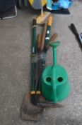 Bundle of Garden Tools and a Watering Can