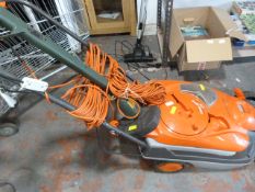 Flymo Roller Compact 4000 Lawnmower, and a Black & Decker Strimmer