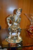 Oriental Figure of a Seated Gentleman