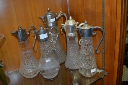 Five Glass Lidded Decanters