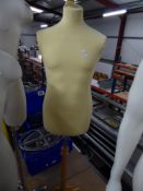 * yellow fabric male upper body on wooden stand