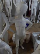 * white childs mannequin on glass stand