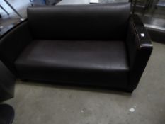 * Brown leather sofa with dark wooden arms and feet. 1450w x 700d x 700h