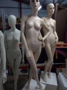 * peach female mannequin - attractive features - white cube stand