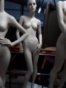 * peach female mannequin - attractive features - white cube stand
