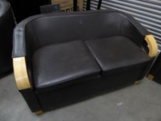 * Brown leather sofa with beech wooden detailing to arms. 1450w x 850d x 850h