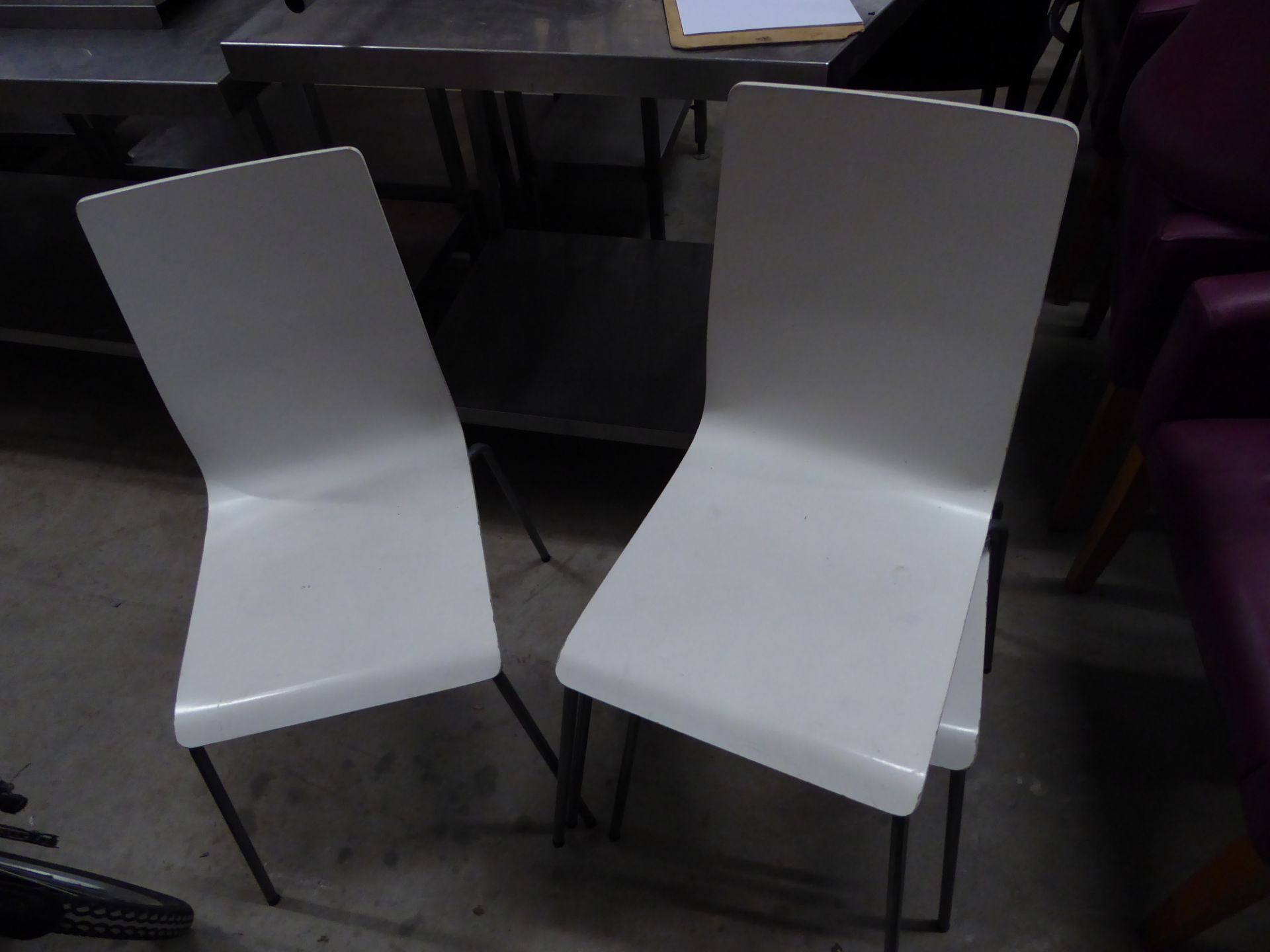 * 4 x white stackable chairs