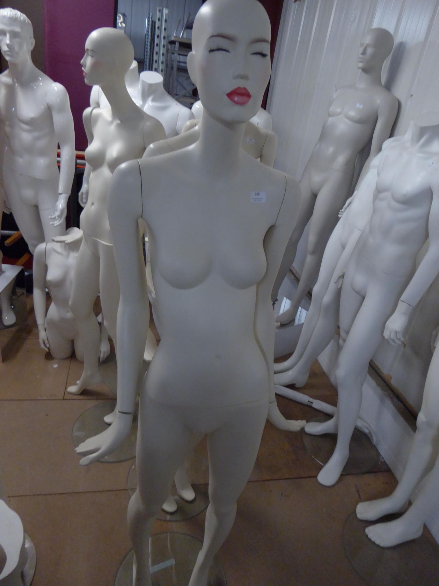* white female mannequin - attractive features - glass stand