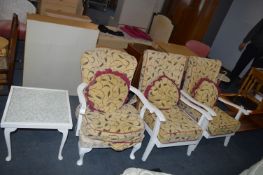 Three White Painted Armchairs and a Coffee Table