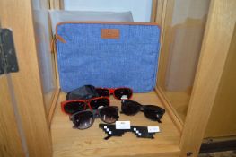 Five Pairs of Sunglasses and a Laptop Bag