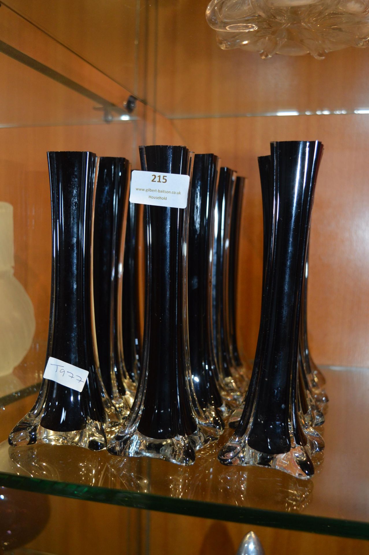 Twelve Black Glass Single Stem Vases