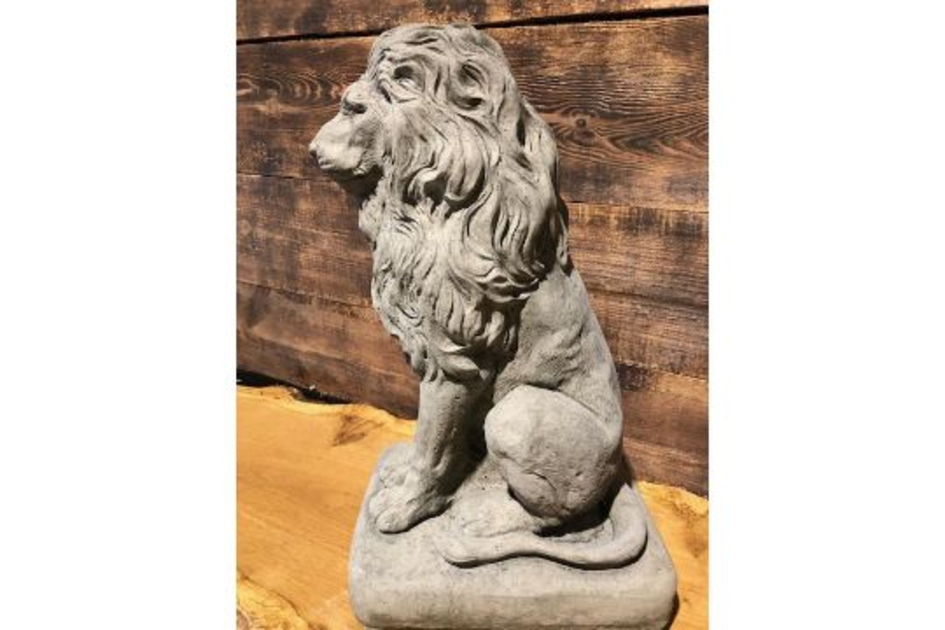 * Large Stone Lion sitting on a plinth