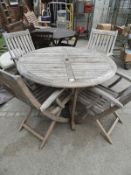 Circular Garden Table with Four Folding Chairs by
