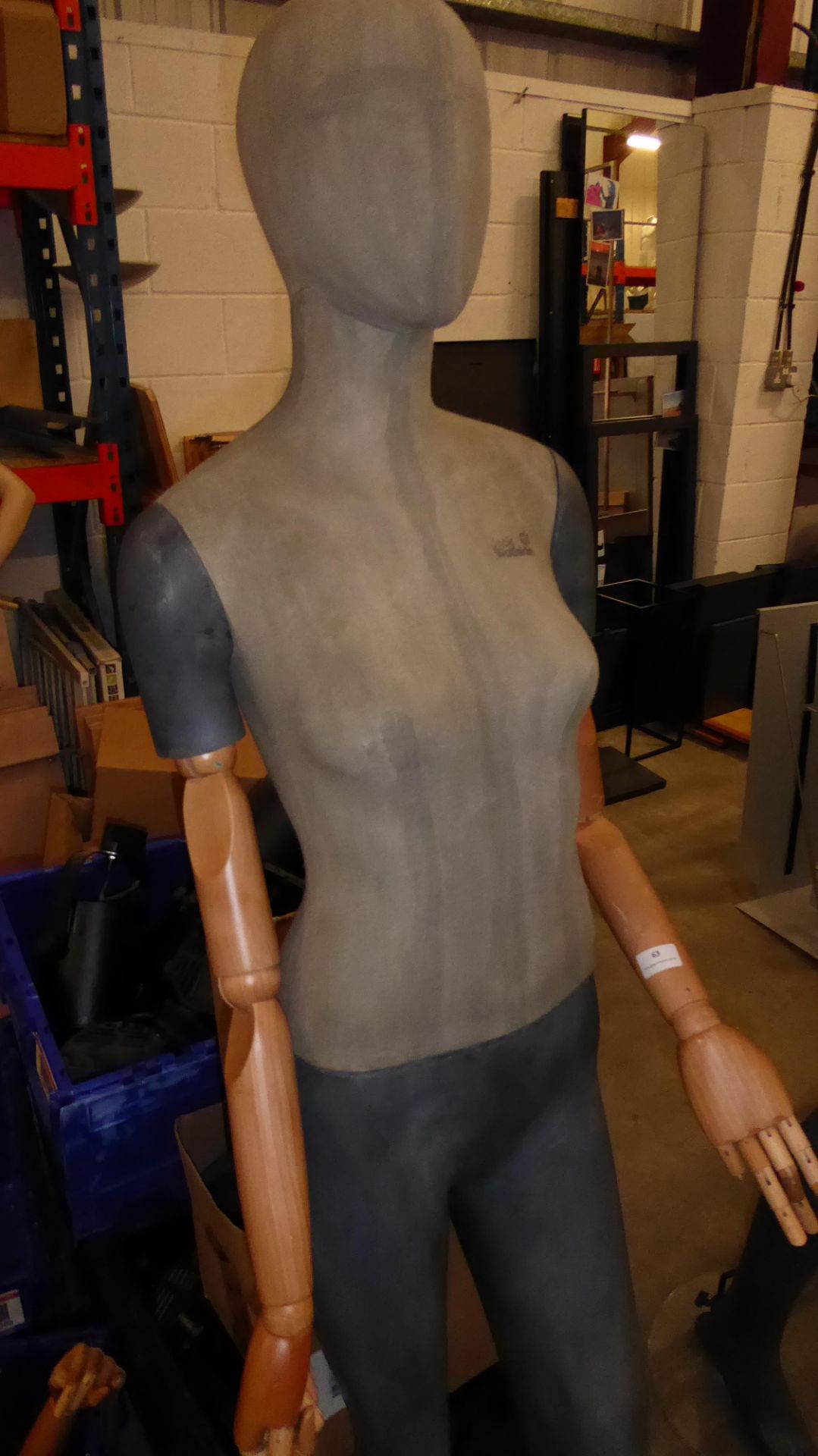 * Tall female mannequin with wooden articulated arms and glass stand. - Image 2 of 3