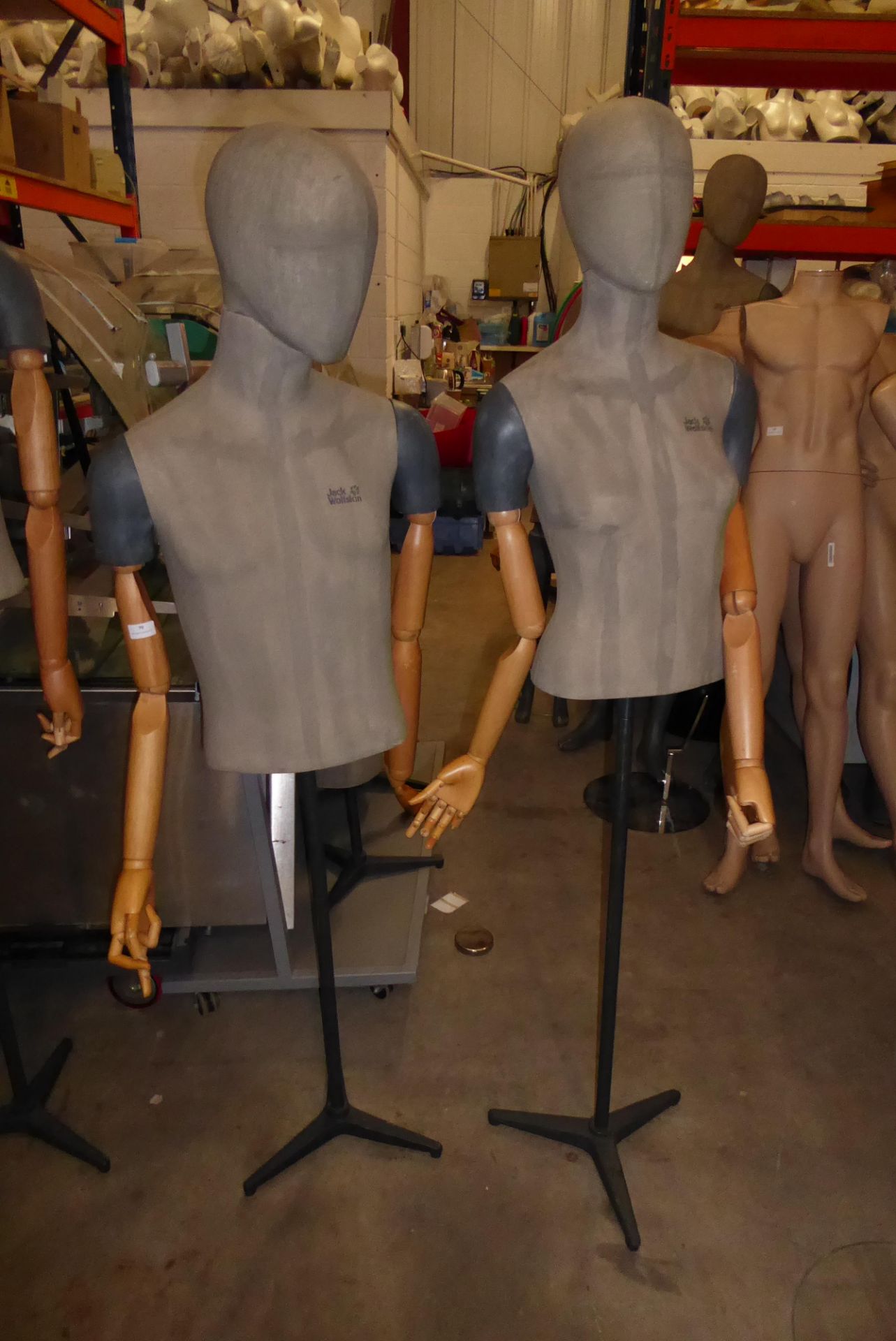 * 2x high quality male and female upper half mannequin with articulated arms on stands.