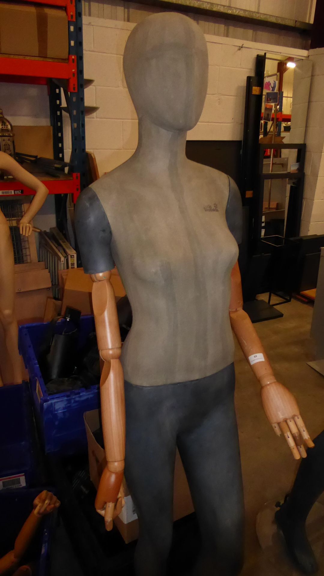 * Tall female mannequin with wooden articulated arms and glass stand. - Image 3 of 3