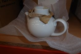 * 6 small white teapots