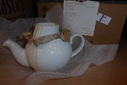 * 6 small white teapots