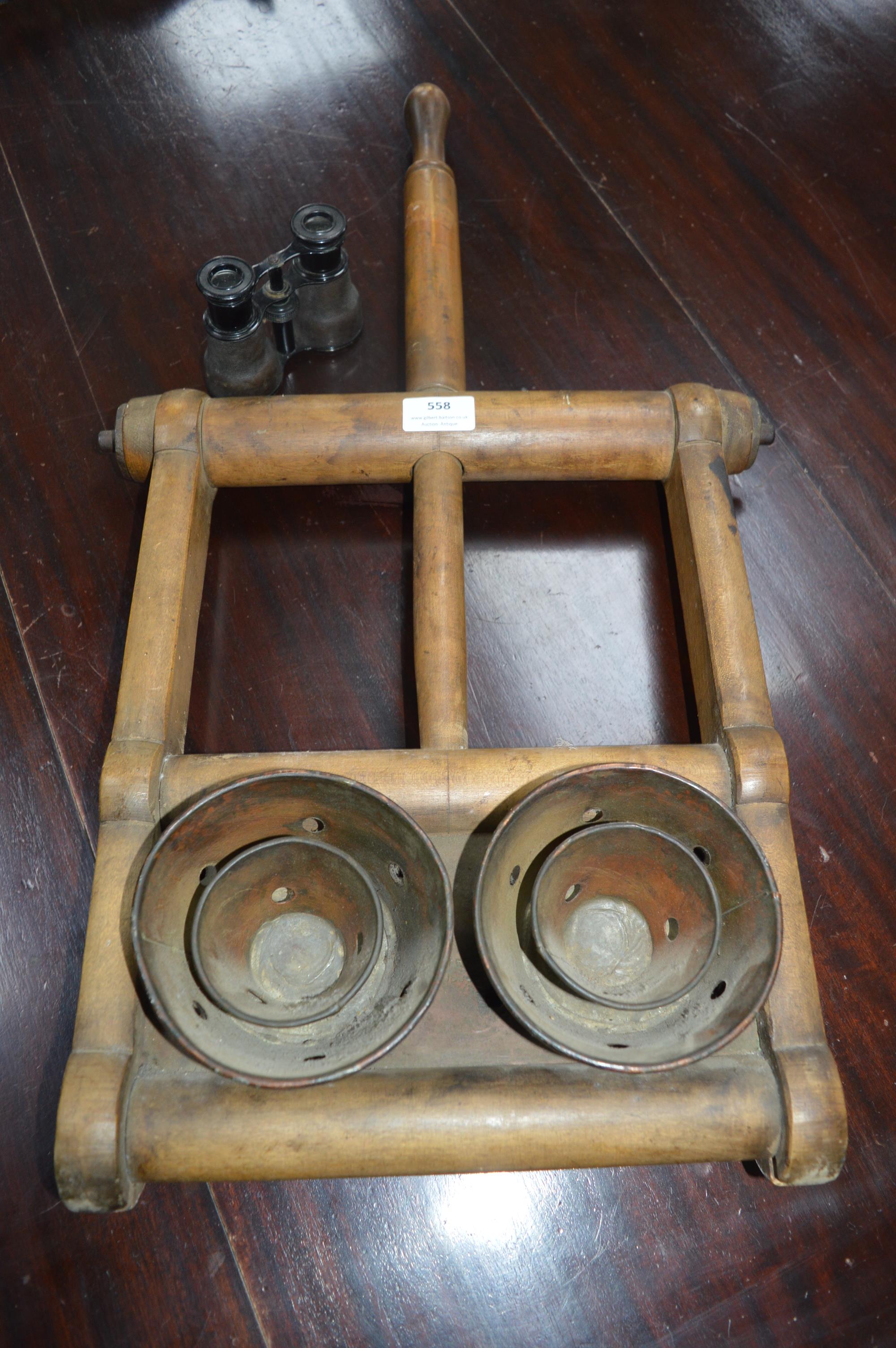 Mechanical Part of a Victorian Washing Machine and a Pair of Binoculars