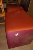 * Two maroon upholstered cubes