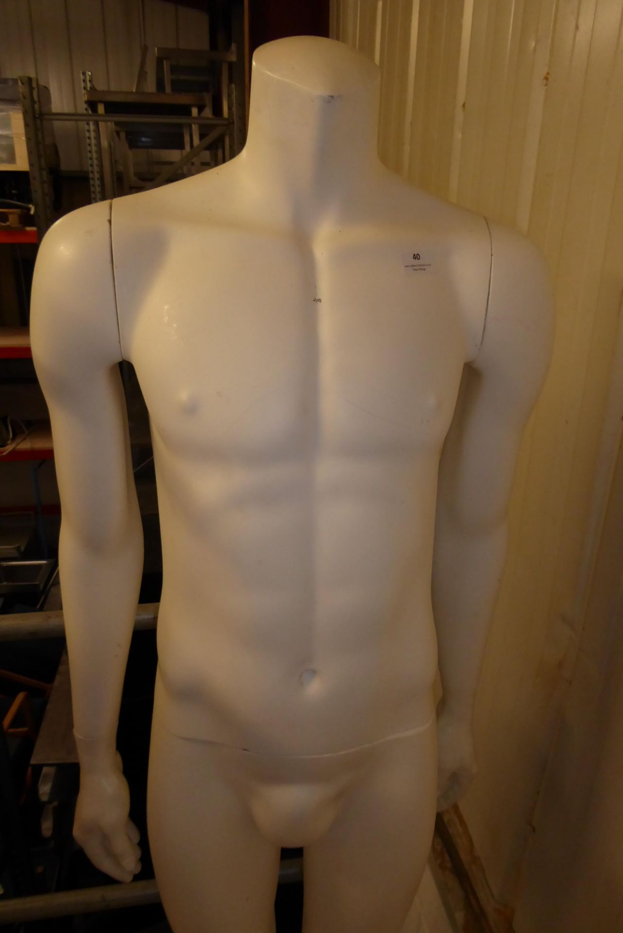 * Single headless male mannequin on stand