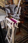 * silver easel and white and pink directors chair