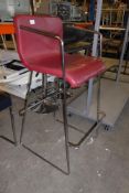 * chrome framed high chair with red seat