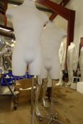 * pair of male torsos on high quality industrial style stands