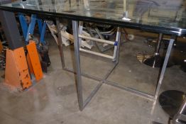* glass table with chrome base. 1000w x 1200d x 800h