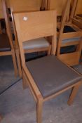 * Twelve upholstered dining chairs brown and cream pads