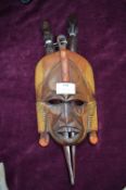 Ethnic Carved Wooden Wall Mask with Wooden Daggers