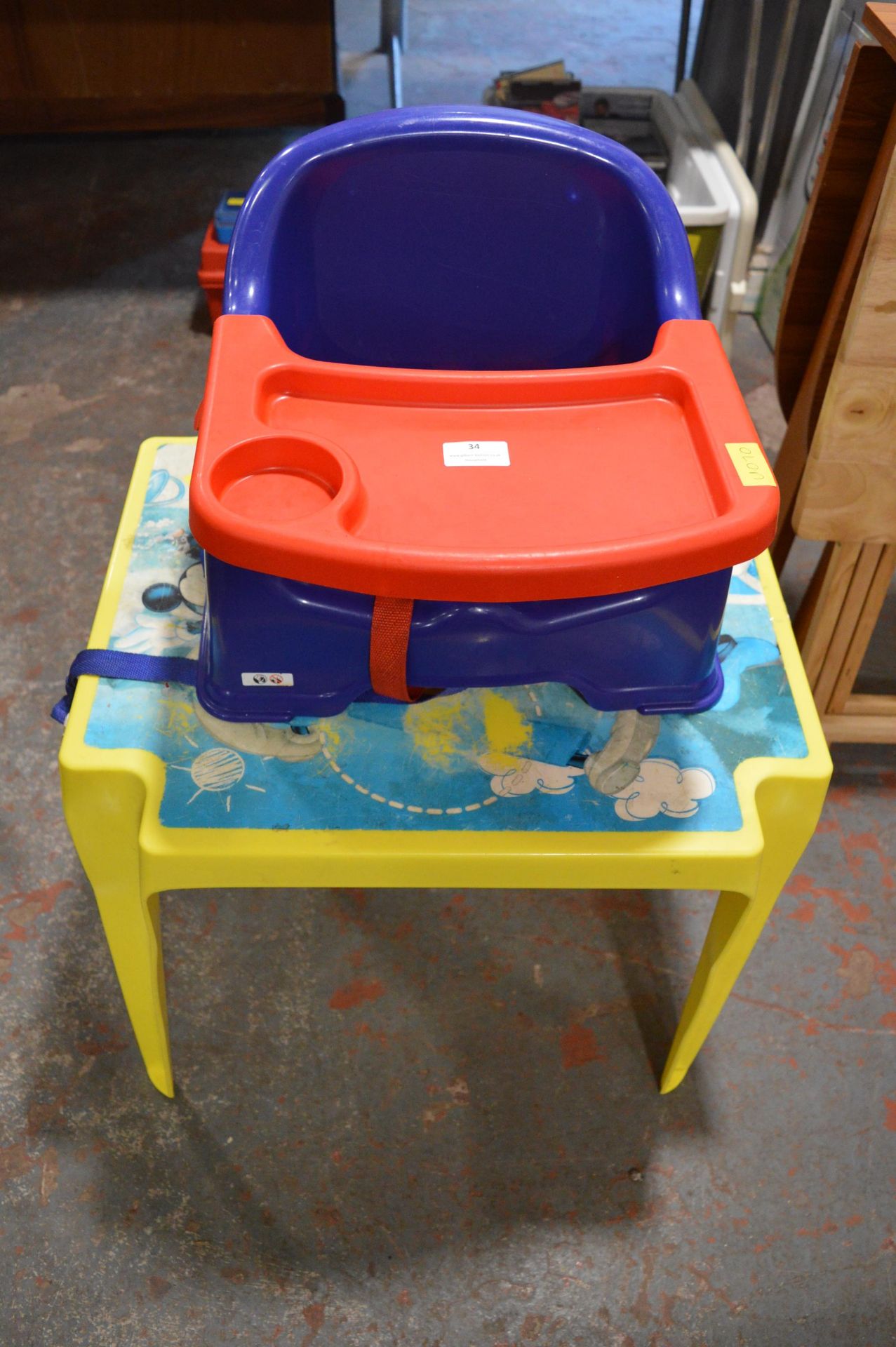 Child's Plastic Table and a Baby Feeding Chair