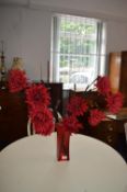Red Glass Vase and Artificial Flowers