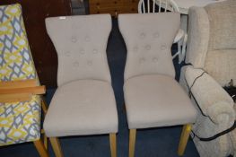 Two Oatmeal Upholstered Dining Chairs