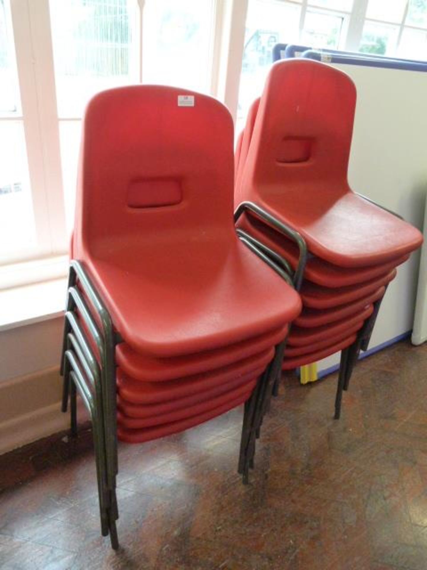 *Thirteen Children's Tubular Framed Red Plastic Chairs