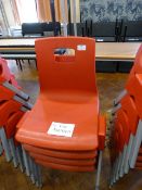 *Four Child's Red Plastic Stackable Chairs