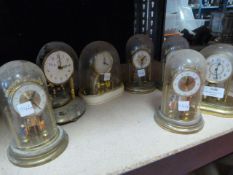 Eight Plastic Dome Clocks (one dome missing)