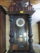 Vintage Wood Cased Wall Clock with Columns and Carved Decoration