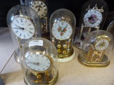 Seven Brass & Porcelain Effect Mantel Clocks with Glass Domes