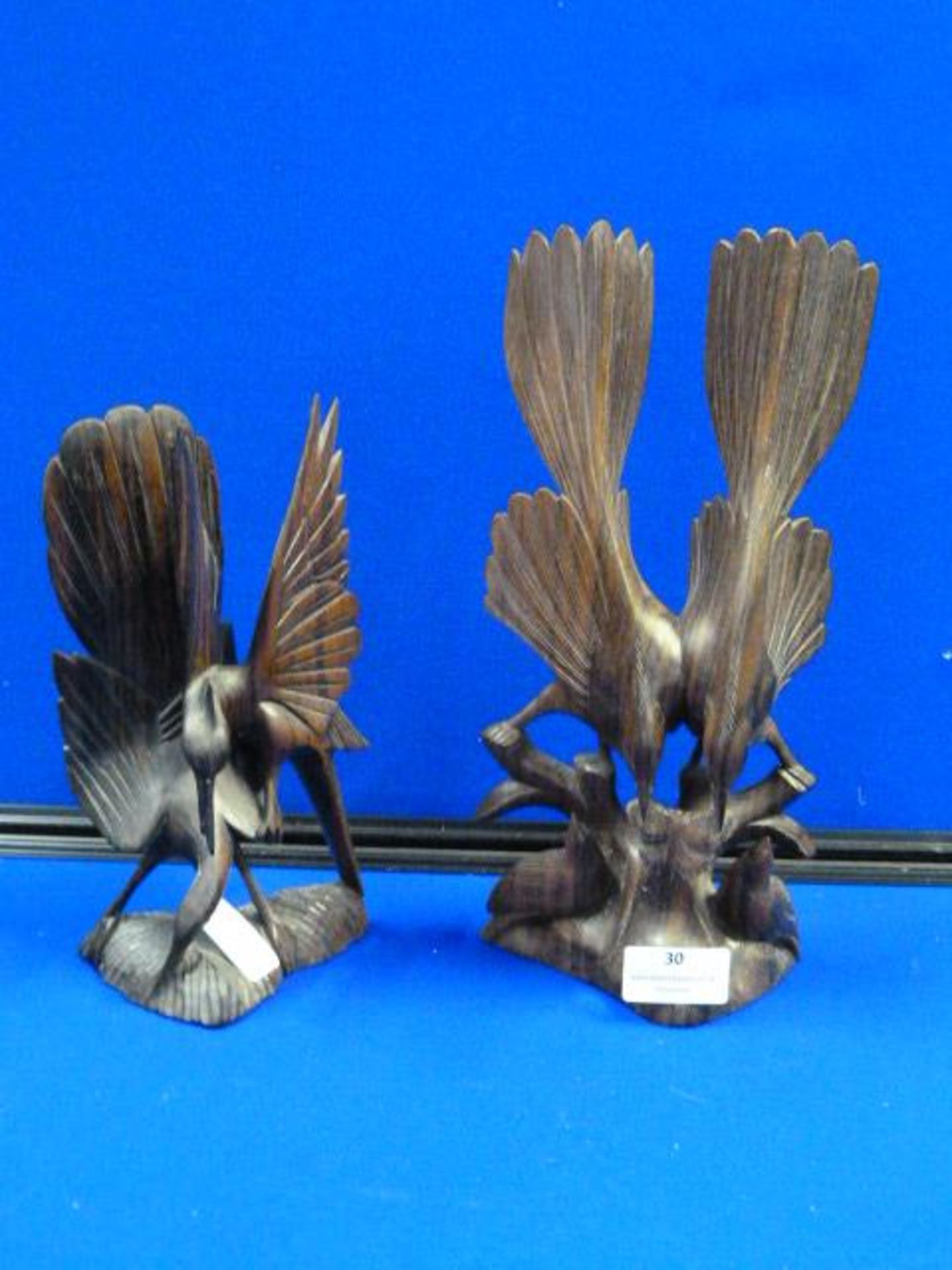 Two Carved Bird Decorations