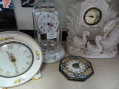 Four Assorted Porcelain and Glazed Clocks