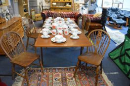 Extending Dining Table with Five Wheelback Chairs