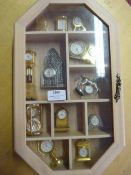 Small Wall Mounted Display Cabinet and Contents of Miniature Clocks