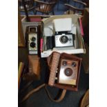 Polaroid Square Shooter 2 Land Camera, Brownie Flash B Box Camera and a Ben & Howell 8mm Cine Camera