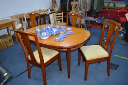 Extending Oval Dining Table with Four Matching Cha