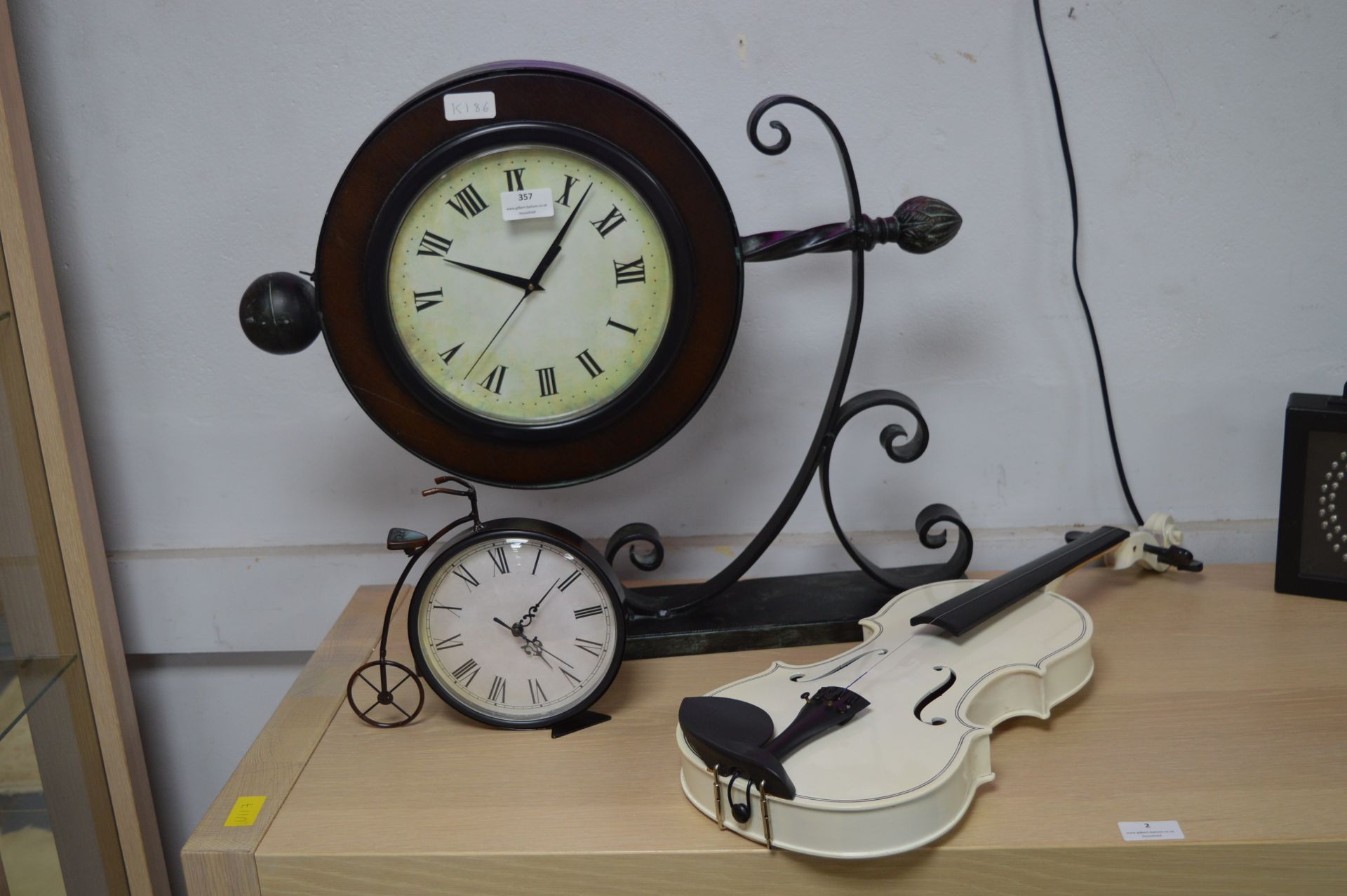 Two Decorative Clocks and a Violin