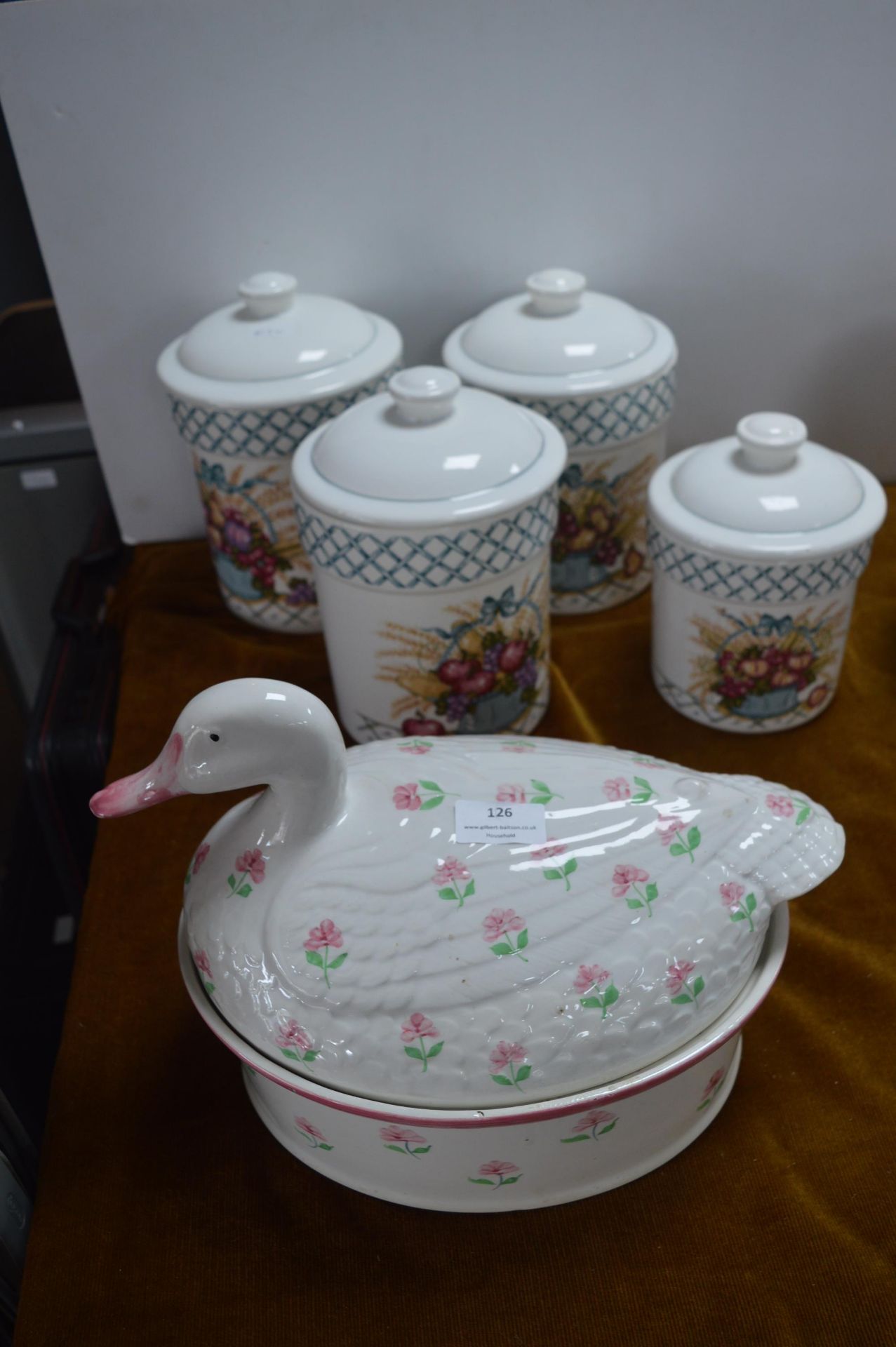 Four Kitchen Storage Jars and a Large Goose Covere