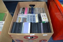 Box of CDs, DVDs, and Videos, etc.